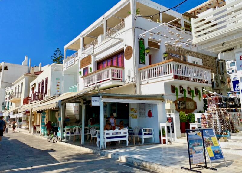 Tourist shops and bars lining the harbor road at Naxos Town.