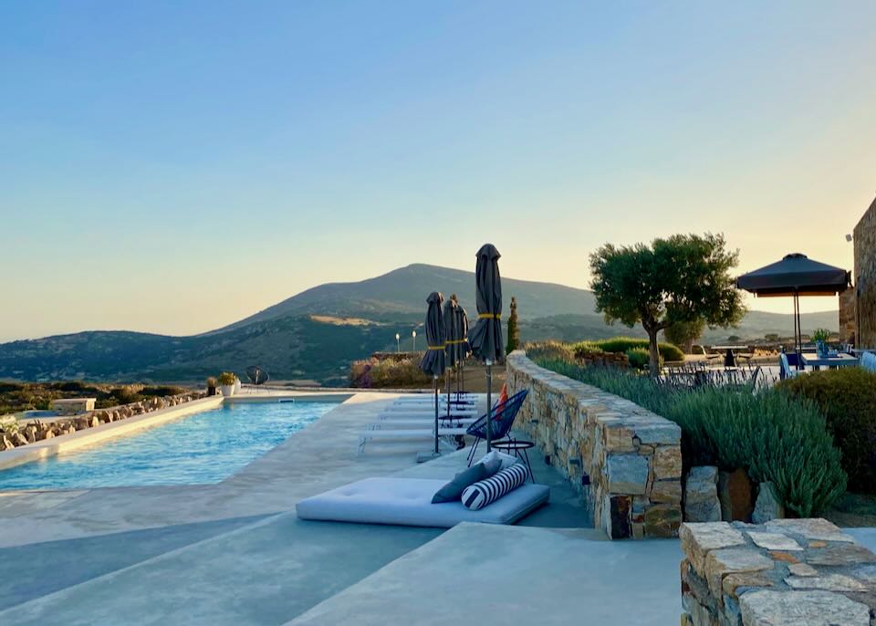 Stone pool deck in the mountains at sunset.