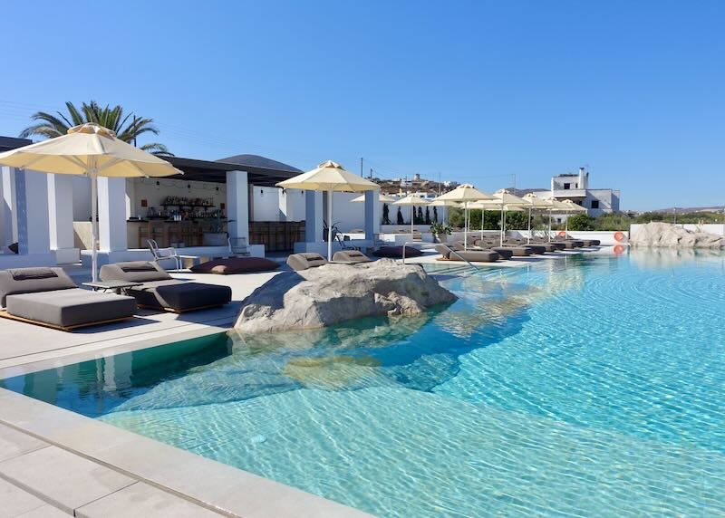 Hotel swimming pool with large rock structures incorporated into one side