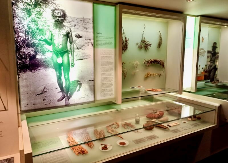 Counter displays and wall photos and text in a museum.