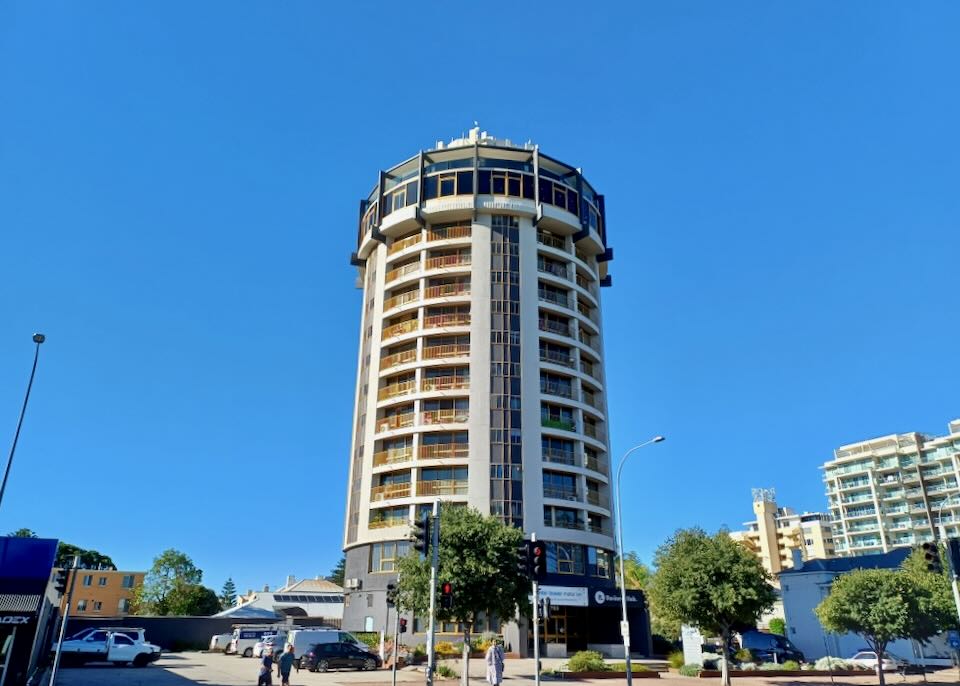 A round tall hotel room with lookout balconies on top.