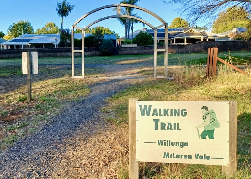 A sign at the beginning of a walking trail.