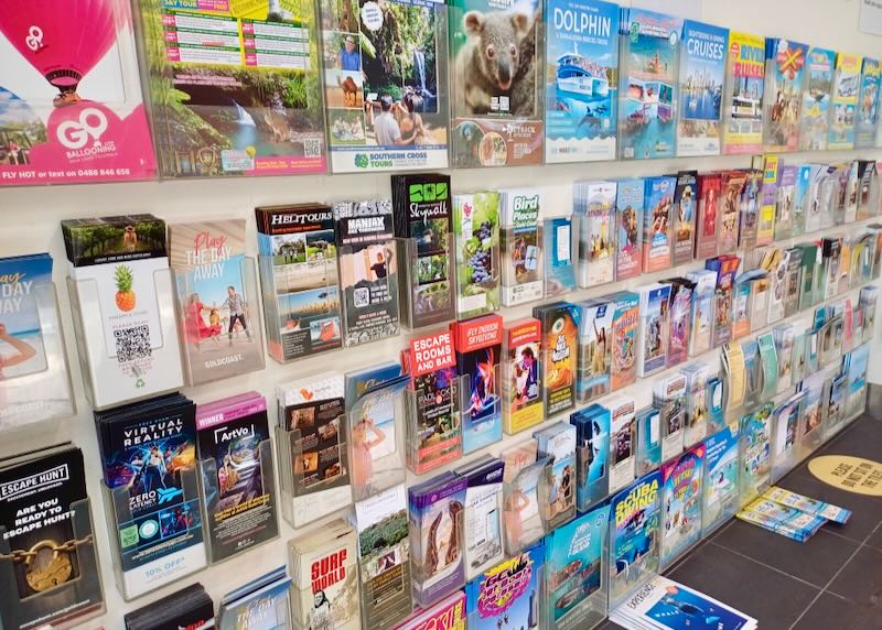 A wall of colorful guides and brochures.