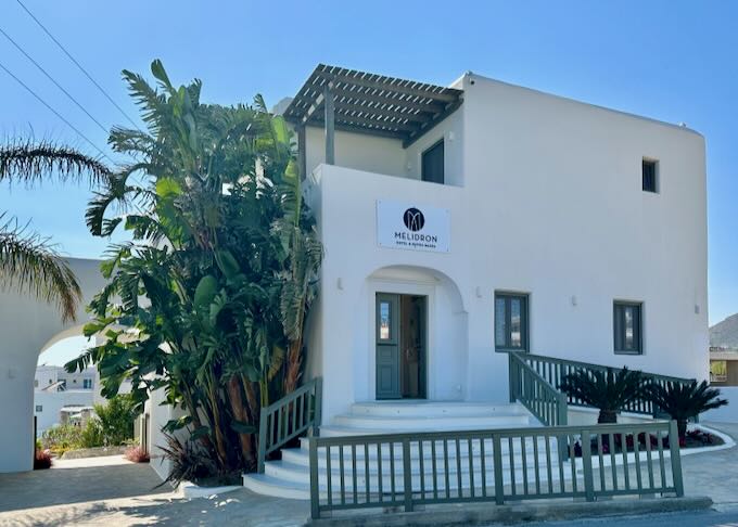 Exterior of a white Cycladic-style hotel