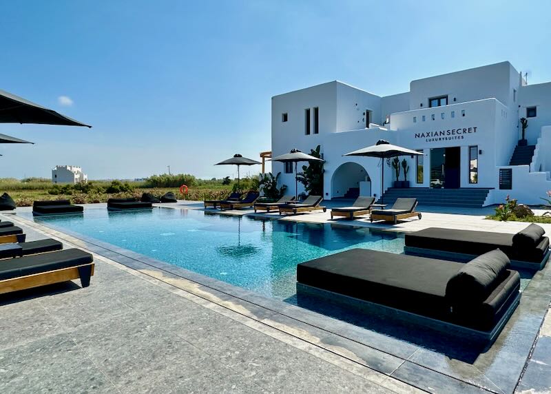 Inviting swim terrace of a Cycladic-style hotel