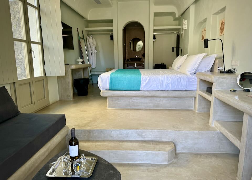 Hotel suite with built-in Cycladic style furnishings.