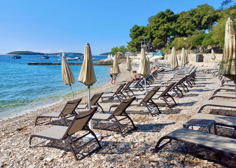 Lounge chairs on the beach.