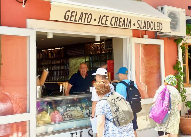 People stand in line for gelato.