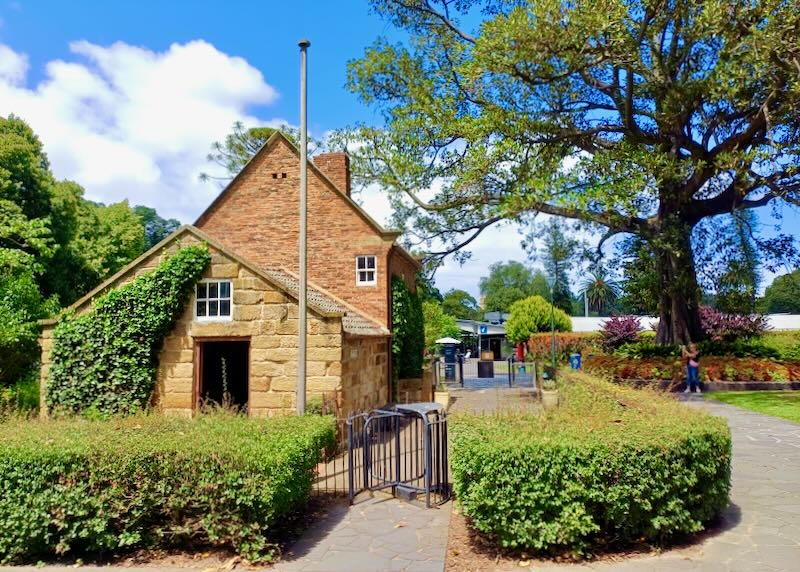 A stone house in a park.