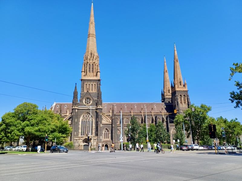 A large old cathedral with pointed spires and flying buttresses.