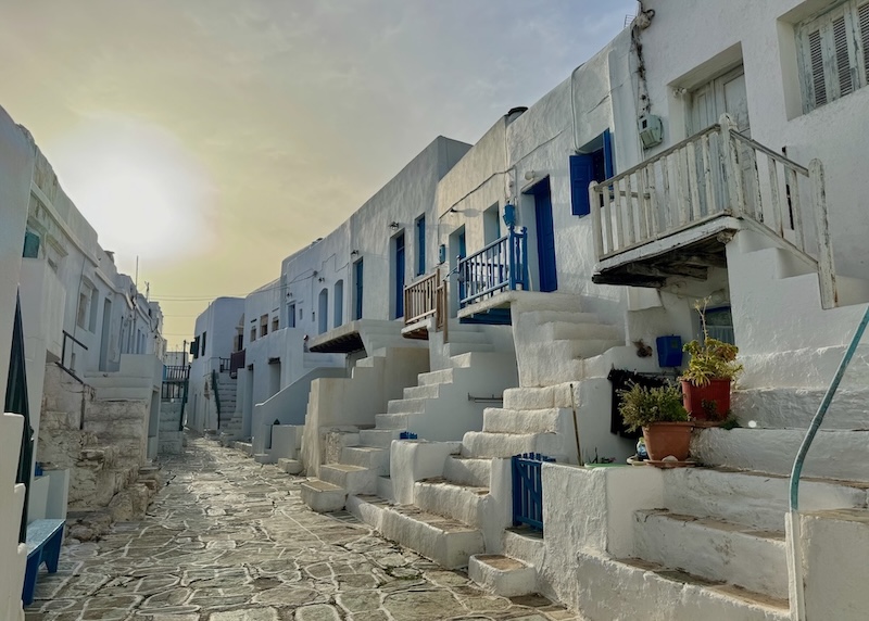 Tightly packed rows of centuries-old homes line a white-outlined flagstone footpath in the Kastro neighborhood of Chora, Folegandros.