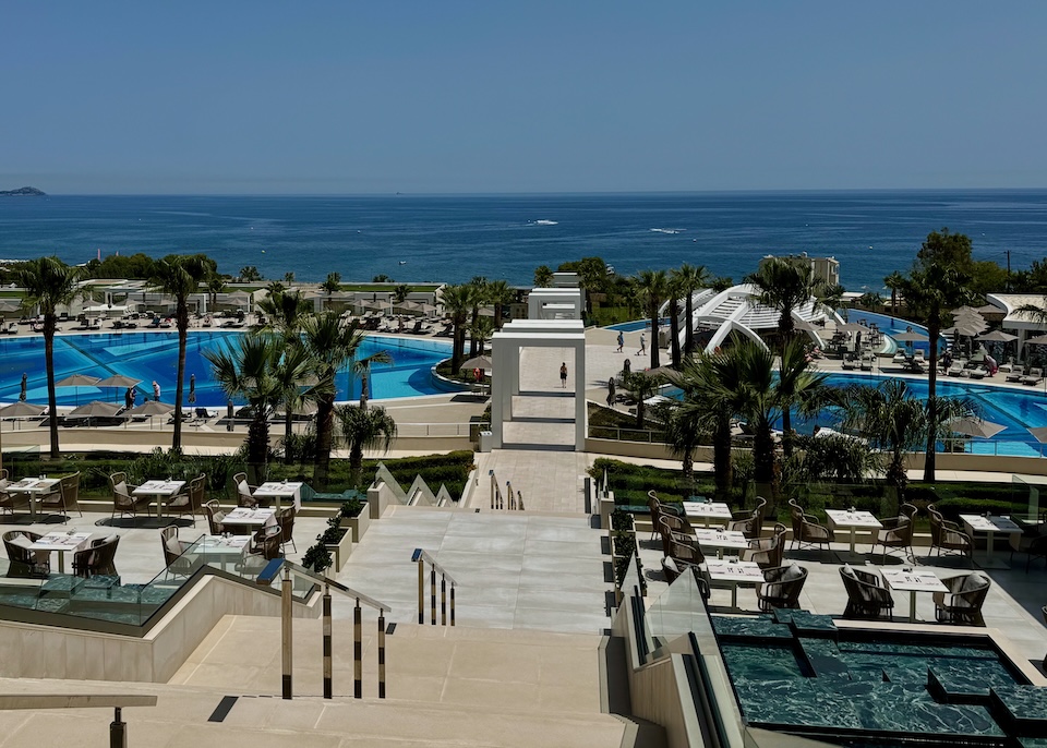 Three pools arranged in a clover shape above the sea at Mayia resort in Kiotari, Rhodes.