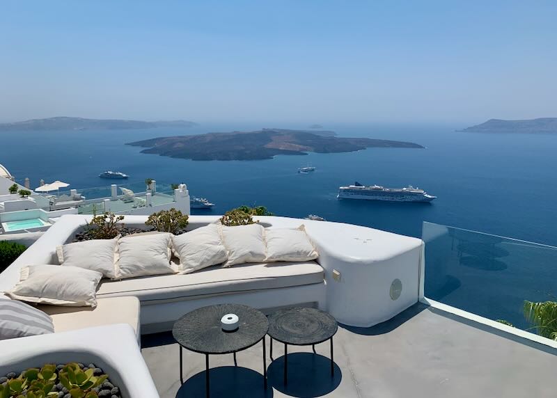 View of the Santorini caldera from the sun terrace of a clifftop hotel