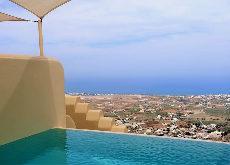 View over Santorini towns to the sea from a hot tub at a hotel in Pyrgos.