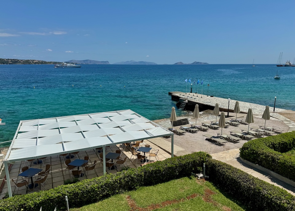 View looking down toward the beach, sea, and dining area at Spetses Hotel.