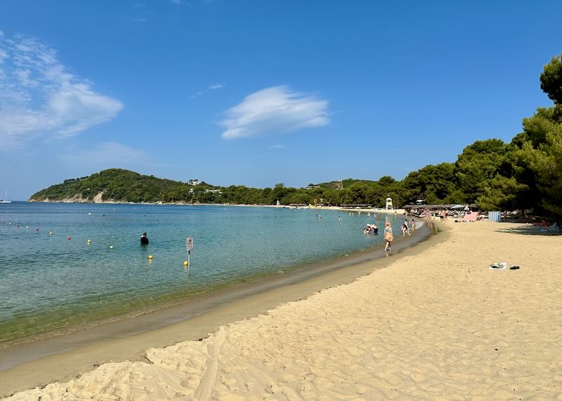 Wide golden sand beach with crystal blue water