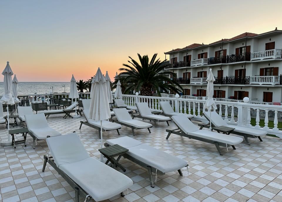 Sun loungers on a terrace at sunset