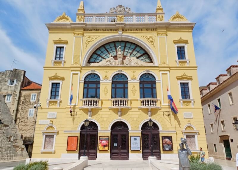 A yellow three-story building.