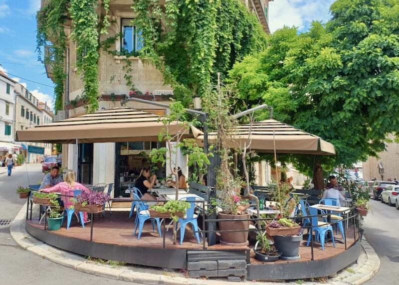 People sit outside at a patio for diner.