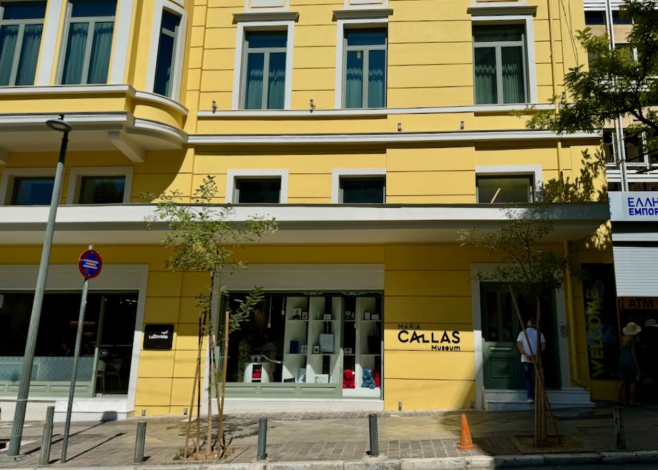 Bright yellow exterior of the Maria Callas Museum in Athens, Greece.