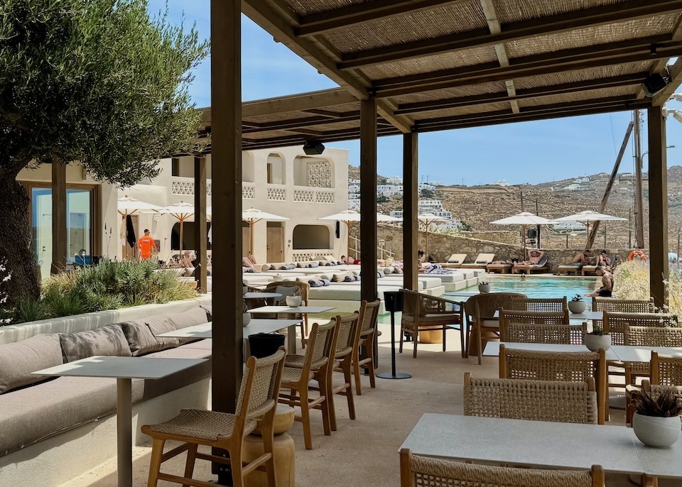 View toward the pool from the signature restaurant at Domes Noruz in Agios Stefanos, Mykonos.