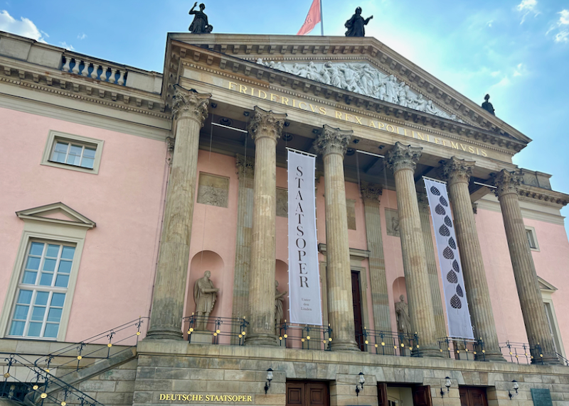 Pink Neoclassical building with columns in front