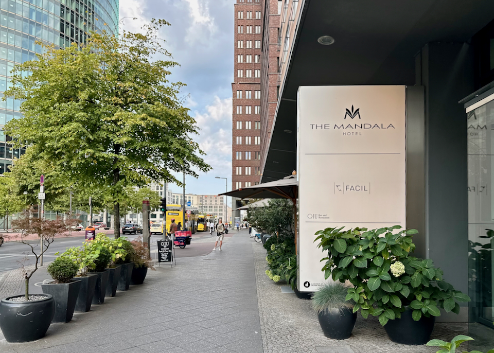 Entrance to a luxury hotel on a leafy street