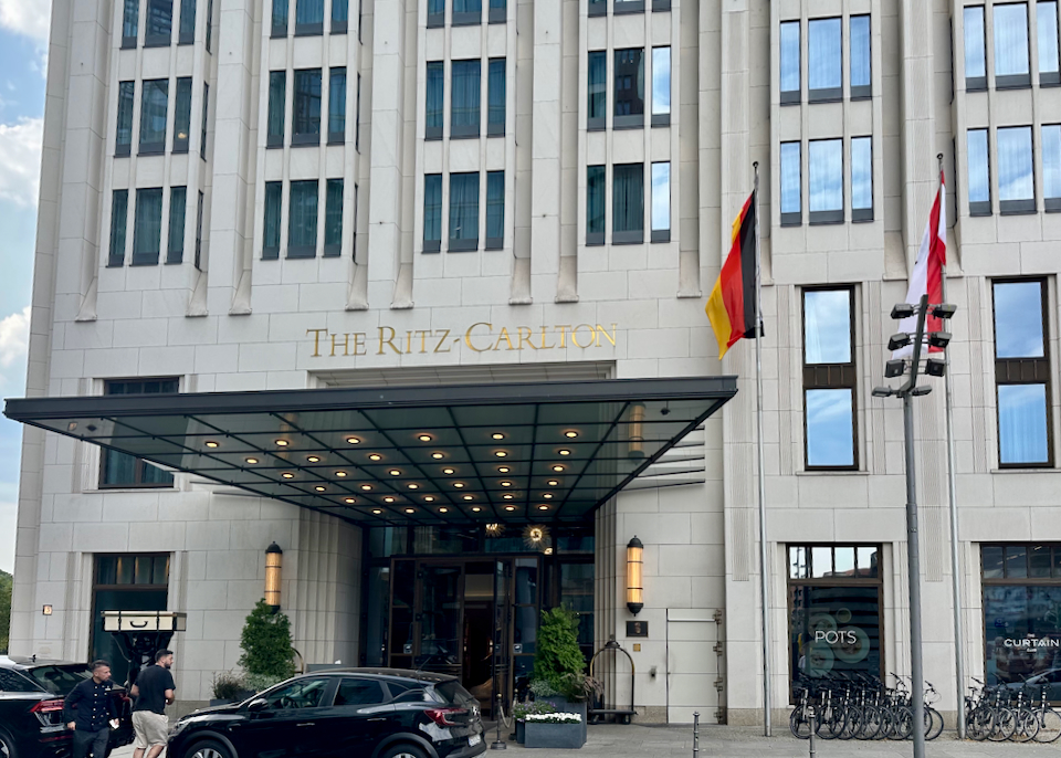 Entrance to the luxury Ritz-Carlton hotel in Berlin, with a doorman standing in front