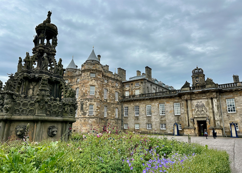 Stone exterior and garden of Holyrood Palace in Edinburgh, Scotland. 