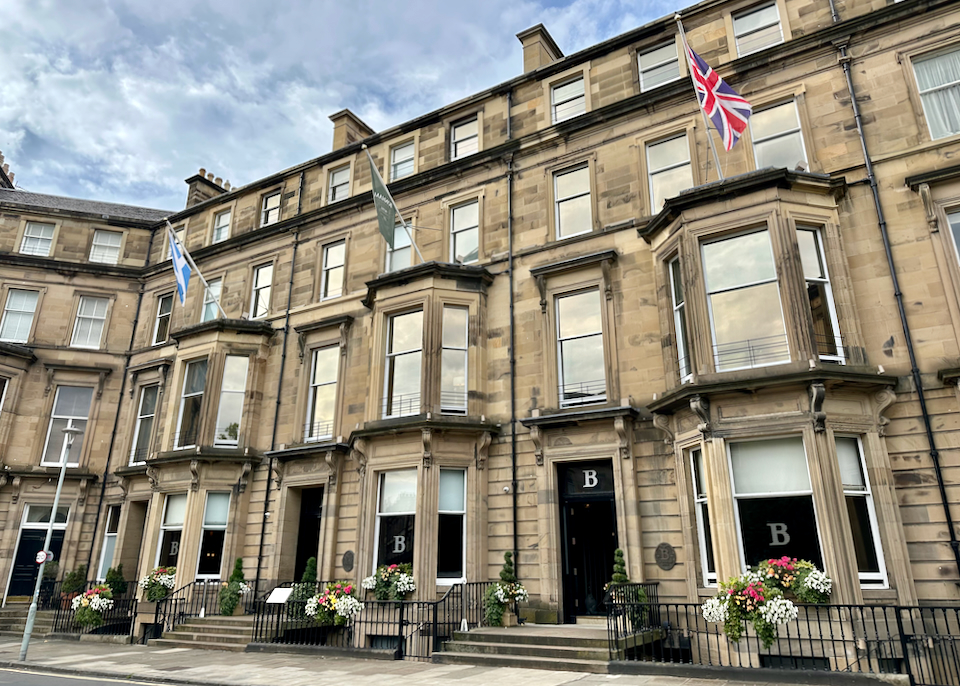 Exterior of an old stone hotel in Edinburgh.