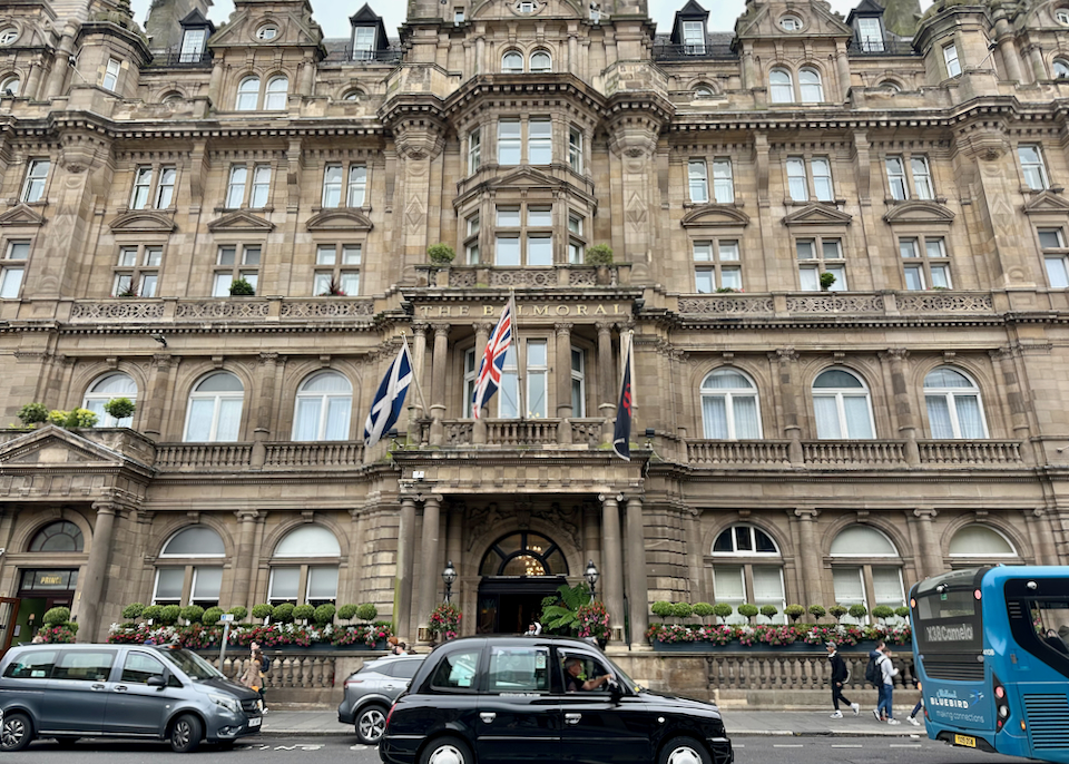 Exterior entrance of the elegant stone Balmoral Hotel in Edinburgh, Scotland