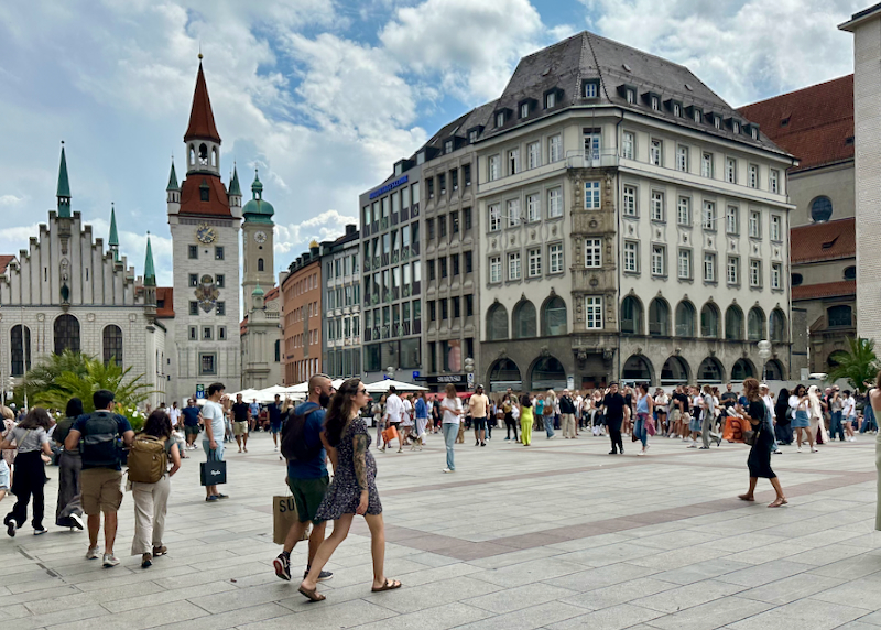 People walk in the pedestrian square of Marienplatz in Munich, Germany