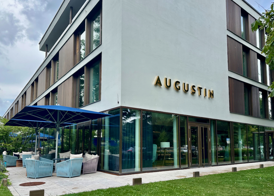 Corner view of a modern hotel with outdoor lounge seating