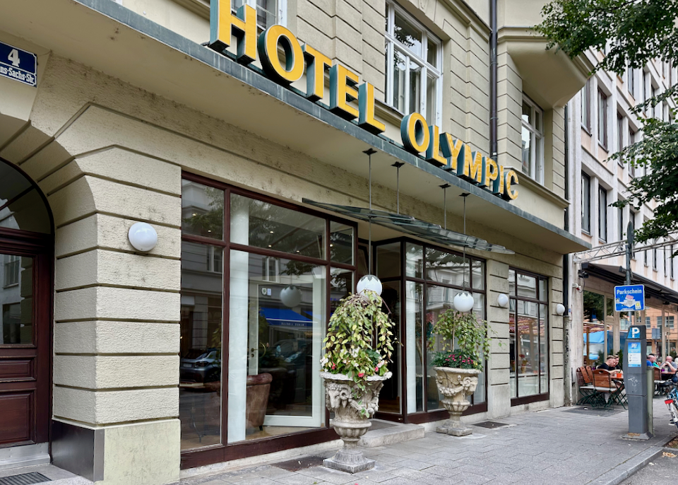 Hotel exterior entrance, with potted plants in front
