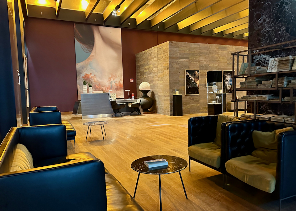 Modern interior of a hotel lobby, with large art pieces on the walls