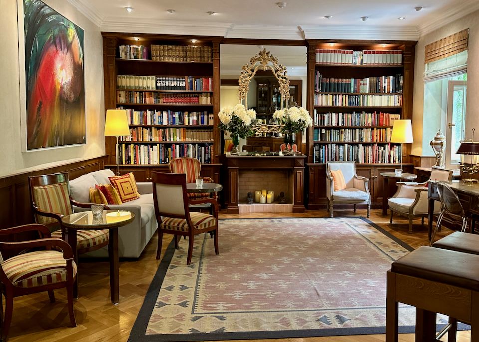 Hotel library lounge with cozy fireplace