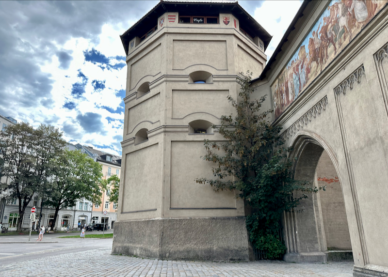 Three story tower with illustrations near the top