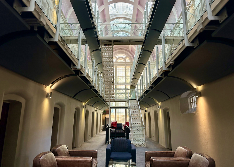 View looking along a row of rooms in a former jail, now boutique hotel