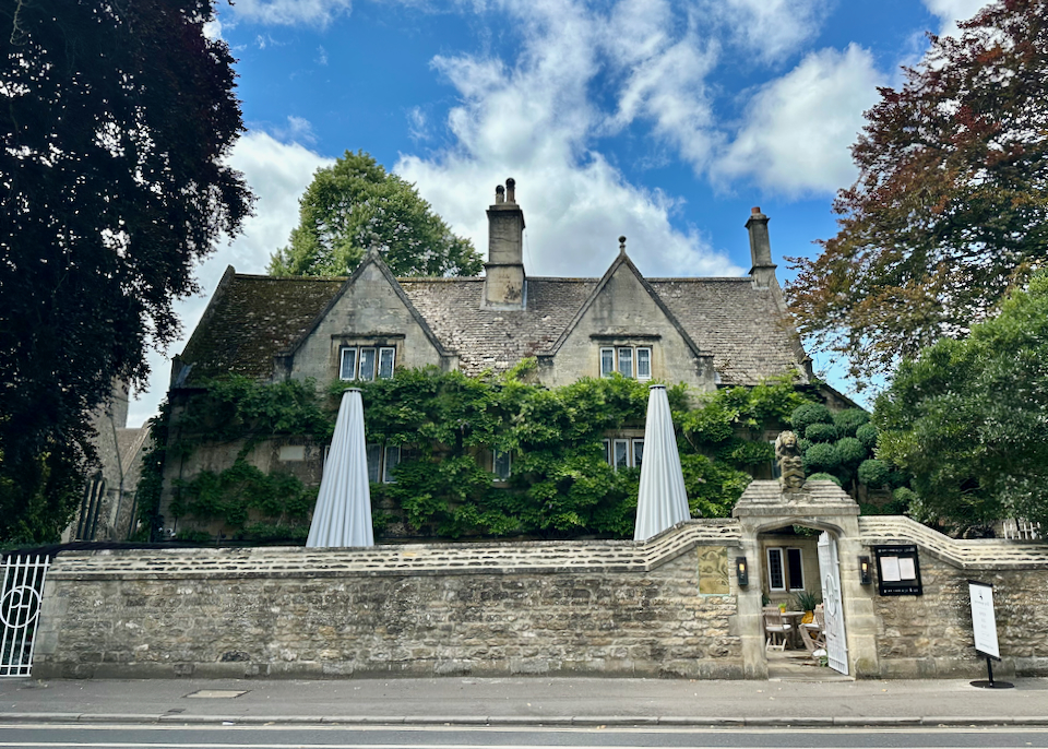 View looking across the street from a stone hotel in an old victorian mansion