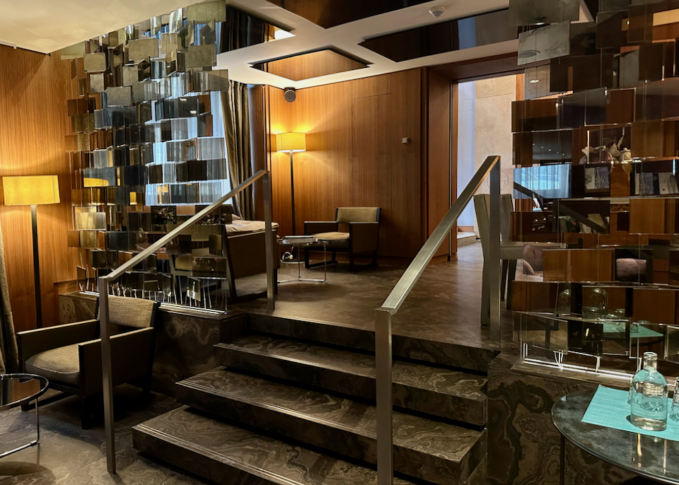 Hotel lobby with dim mood lighting and midcentury design