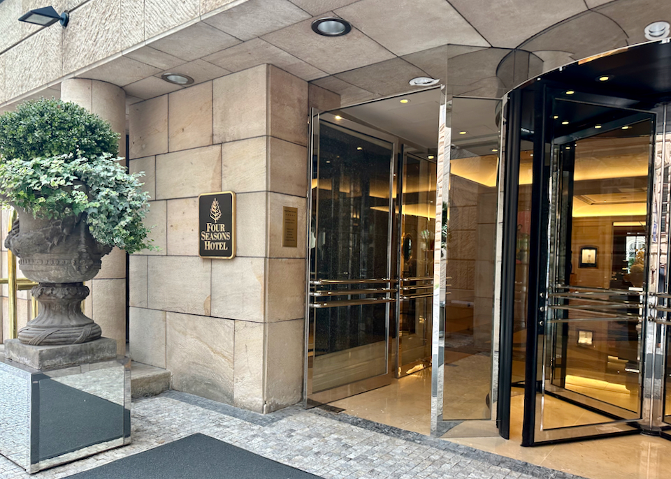 Gleaming revolving door entrance to a luxury hotel