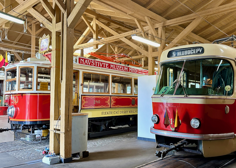 Old train cars housed in a museum building