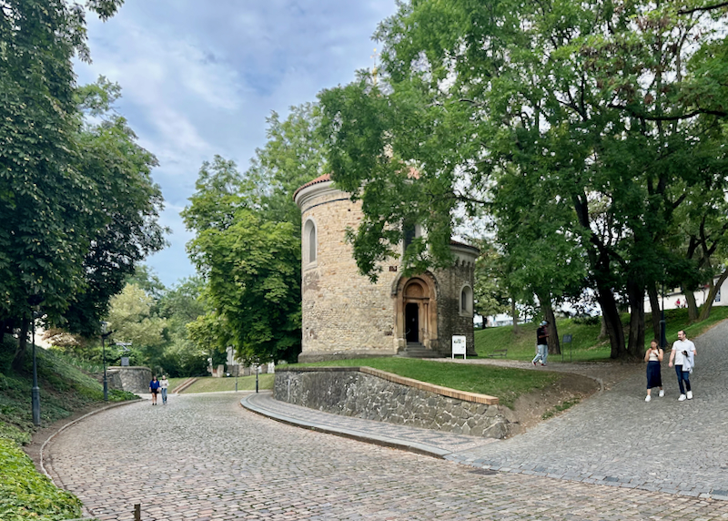 People walk around a round castle structure