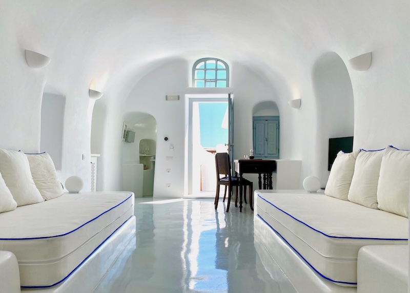 The living room of a spacious cave suite at Oia Spirit Boutique Residences in Oia.
