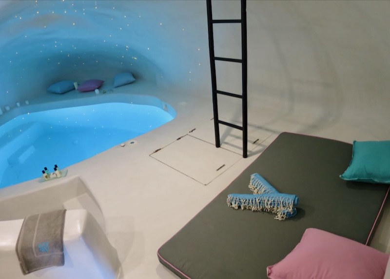An indoor cave plunge pool with a starlit ceiling at Sophia Luxury Suites in Imerovigli.
