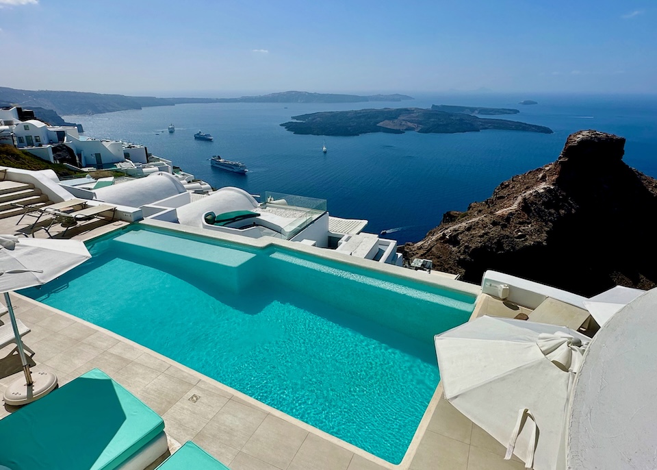 View over the caldera toward Skaros Rock, the volcanoes, and Akrotiri at Astra Suites in Santorini.