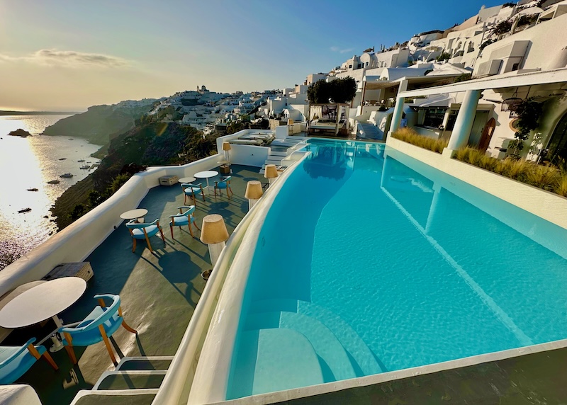 Infinity pool and dining terrace above the caldera at Katikies Kirini hotel in Santorini.