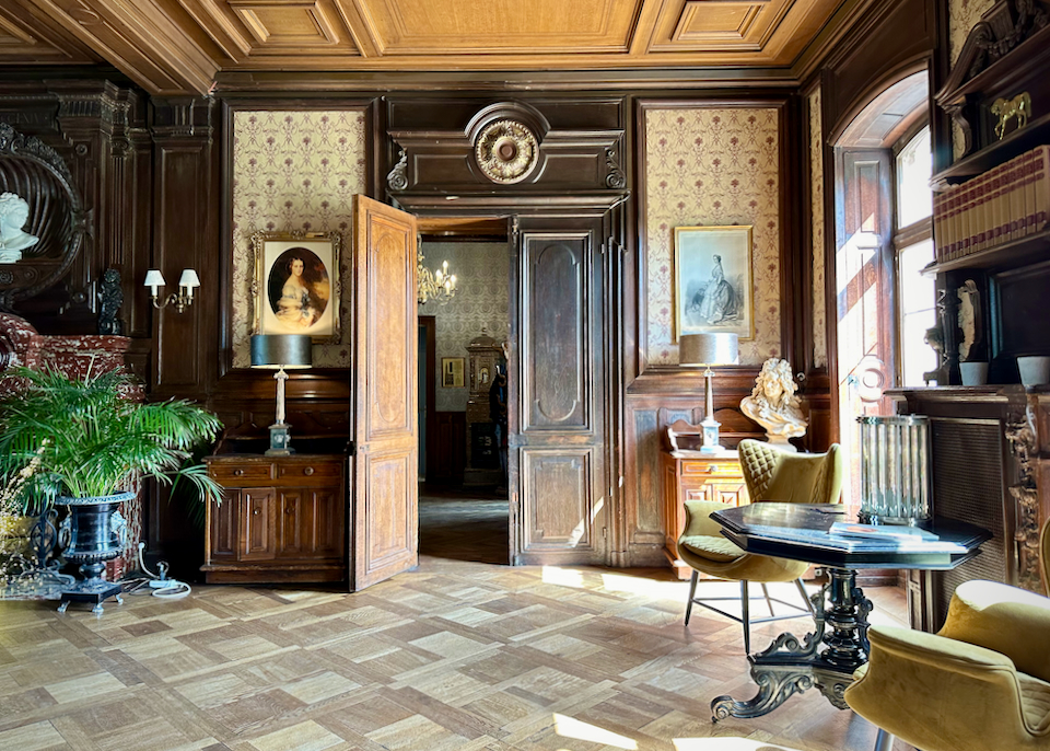 Light streams through the window of an elegant historic drawing room