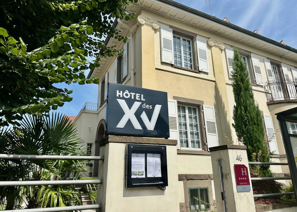 Hotel exterior on a leafy street