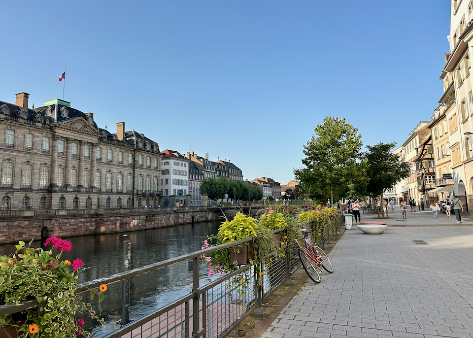 Canal lined with colorful buildings and flowers